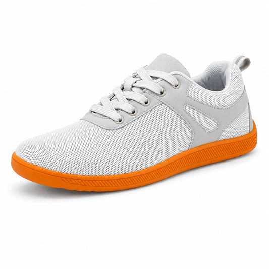 Zapatilla barefoot casual gris con suela naranja, ultra ligera y flexible.
