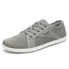 Zapatilla minimalista Saguaro gris, puntera ancha y zero drop.